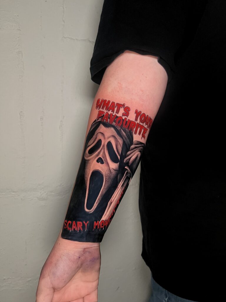 Close up of a black and grey realism tattoo with detailed shading and contrast
