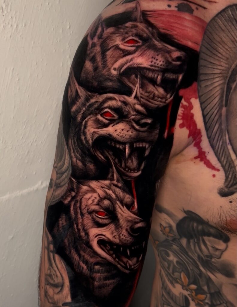 Black and grey realism three headed dog tattoo with dark mythological details